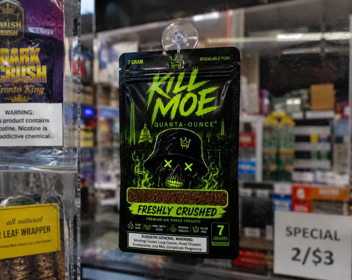 Kill Moe pouch hanging in a DMV store window